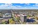 Beautiful aerial shows a high rise condo near the city with mature trees and tennis courts at 4000 N Meridian St # 9E, Indianapolis, IN 46208