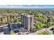 Aerial shows the condo, parking, mature trees, and neighborhood at 4000 N Meridian St # 9E, Indianapolis, IN 46208