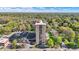 High rise condo surrounded by mature trees, grass, and parking lot at 4000 N Meridian St # 9E, Indianapolis, IN 46208