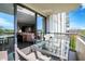 Cozy balcony with outdoor dining set, offering a glimpse into the stylishly furnished living room at 4000 N Meridian St # 9E, Indianapolis, IN 46208