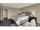 Cozy bedroom with a plush bed, neutral decor, and soft lighting at 4000 N Meridian St # 9E, Indianapolis, IN 46208