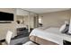 Comfortable bedroom with stylish decor, mirrored wall, and cozy lighting at 4000 N Meridian St # 9E, Indianapolis, IN 46208
