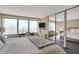 Bright bedroom with a large window, study desk, and mirror sliding door to another bedroom at 4000 N Meridian St # 9E, Indianapolis, IN 46208
