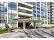 Modern building entrance featuring a covered drop-off and manicured landscaping, offering a welcoming arrival experience at 4000 N Meridian St # 9E, Indianapolis, IN 46208