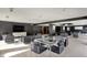 Inviting common room with plush seating, large screen TV, and tables, perfect for residents to relax and socialize at 4000 N Meridian St # 9E, Indianapolis, IN 46208
