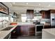 Well-equipped kitchen boasting stainless steel appliances, granite countertops, and dark cabinetry at 4000 N Meridian St # 9E, Indianapolis, IN 46208