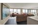 Bright living room with comfortable seating, large windows, and balcony access at 4000 N Meridian St # 9E, Indianapolis, IN 46208
