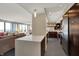 Bright and open living space featuring a modern kitchen, comfortable seating, and ample natural light at 4000 N Meridian St # 9E, Indianapolis, IN 46208