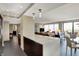 Open living area featuring modern lighting, a cozy couch, and large windows with natural light at 4000 N Meridian St # 9E, Indianapolis, IN 46208