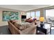 Spacious living room features modern decor, and access to a balcony at 4000 N Meridian St # 9E, Indianapolis, IN 46208