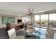 Open-concept living and dining area with balcony at 4000 N Meridian St # 9E, Indianapolis, IN 46208