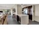 Spacious living area with view of modern kitchen with stainless steel appliances and stone countertop at 4000 N Meridian St # 9E, Indianapolis, IN 46208