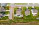 Aerial view of a home's backyard featuring a pool, hot tub, and trampoline, with approximate property lines outlined in red at 403 N Crystal Dr, Fortville, IN 46040