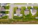 An aerial perspective of the backyard of a house, showcasing a pool, hot tub, and trampoline at 403 N Crystal Dr, Fortville, IN 46040