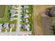 Aerial view of a residential neighborhood with houses with green lawns and mature trees in a suburban setting at 403 N Crystal Dr, Fortville, IN 46040
