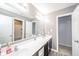 This bathroom features a dual sink vanity, a large mirror, and modern fixtures at 403 N Crystal Dr, Fortville, IN 46040
