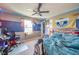 This bedroom has a Howies Hockey Tape theme and features a ceiling fan and desk with chair at 403 N Crystal Dr, Fortville, IN 46040