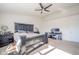 Spacious bedroom features a ceiling fan, carpeted floors, and a dark wood bedroom suite at 403 N Crystal Dr, Fortville, IN 46040