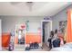 This bedroom has a Ford theme and features a ceiling fan, a mirror, and an orange accent wall at 403 N Crystal Dr, Fortville, IN 46040