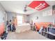 This bedroom is decorated with an Indiana University theme and features a ceiling fan and orange accents at 403 N Crystal Dr, Fortville, IN 46040