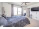 This well-lit bedroom features a gray bedspread, large windows, and a mirrored closet door at 403 N Crystal Dr, Fortville, IN 46040