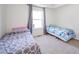 Cozy bedroom with carpeted floors and a window provides a comfortable and private retreat for rest and relaxation at 403 N Crystal Dr, Fortville, IN 46040