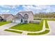 Beautiful two-story home with a two car garage, spacious yard and an in-ground trampoline and basketball court at 403 N Crystal Dr, Fortville, IN 46040