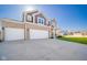 Exterior view of a two-story house with a three-car garage and a large driveway under a sunny sky at 403 N Crystal Dr, Fortville, IN 46040