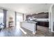 Bright kitchen features a large island, stainless steel appliances, and access to the backyard at 403 N Crystal Dr, Fortville, IN 46040