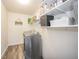 Laundry room with shelving units, washer, dryer, and a sign that reads Laundry: Loads of Fun at 403 N Crystal Dr, Fortville, IN 46040