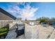 Outdoor patio area featuring a grill, outdoor lights, and lounge chairs, perfect for summer evenings at 403 N Crystal Dr, Fortville, IN 46040