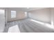A bright bedroom showcases neutral carpeting and two large windows that provide ample natural light at 4046 Denali Dr, Indianapolis, IN 46235