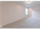 A cozy bedroom with soft carpet and natural light from one window at 4046 Denali Dr, Indianapolis, IN 46235