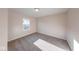 A cozy bedroom with neutral carpet, one window, and soft, natural lighting at 4046 Denali Dr, Indianapolis, IN 46235