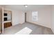 A spacious bedroom featuring soft carpet, closet, and a window for natural light at 4046 Denali Dr, Indianapolis, IN 46235
