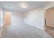 Bright bedroom with carpet, closet, and doorways leading to the hallway and bathroom at 4046 Denali Dr, Indianapolis, IN 46235