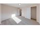 Carpeted bedroom with large closet and doorway leading to another room at 4046 Denali Dr, Indianapolis, IN 46235
