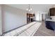 Bright kitchen with stainless steel appliances, dark cabinets, and views into the living areas at 4046 Denali Dr, Indianapolis, IN 46235