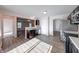 Bright kitchen with stainless steel appliances, dark cabinets, and stylish countertops at 4046 Denali Dr, Indianapolis, IN 46235