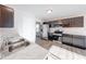 Kitchen features stainless steel appliances, dark cabinetry and hardwood style floors at 4046 Denali Dr, Indianapolis, IN 46235