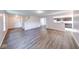 Spacious living room with hardwood floors and an open floor plan with views to the kitchen at 4046 Denali Dr, Indianapolis, IN 46235