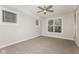 Carpeted bedroom with three windows that provide natural light at 4077 Rookwood Ave, Indianapolis, IN 46208