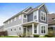 Charming two-story home with gray siding, white trim, and a well-maintained front yard at 4077 Rookwood Ave, Indianapolis, IN 46208