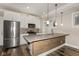 Stylish kitchen featuring modern appliances, a spacious island, and ample natural light at 4077 Rookwood Ave, Indianapolis, IN 46208