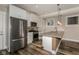 Modern kitchen featuring stainless steel appliances, white cabinets, and a center island with a sink at 4077 Rookwood Ave, Indianapolis, IN 46208