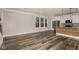 Open floorplan showcasing a modern kitchen, hard flooring, and natural lighting at 4077 Rookwood Ave, Indianapolis, IN 46208
