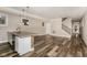 Open-concept living space featuring modern kitchen, island seating, and hardwood floors at 4077 Rookwood Ave, Indianapolis, IN 46208
