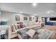 Spacious basement with a large sectional sofa and a cozy atmosphere at 4125 Rookwood Ave, Indianapolis, IN 46208
