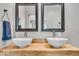 Charming bathroom featuring double sinks with vessel basins, complemented by rustic wood accents and modern fixtures at 4125 Rookwood Ave, Indianapolis, IN 46208