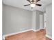 This bedroom features hardwood floors, a ceiling fan, neutral walls, and is ready for personal touches at 4125 Rookwood Ave, Indianapolis, IN 46208